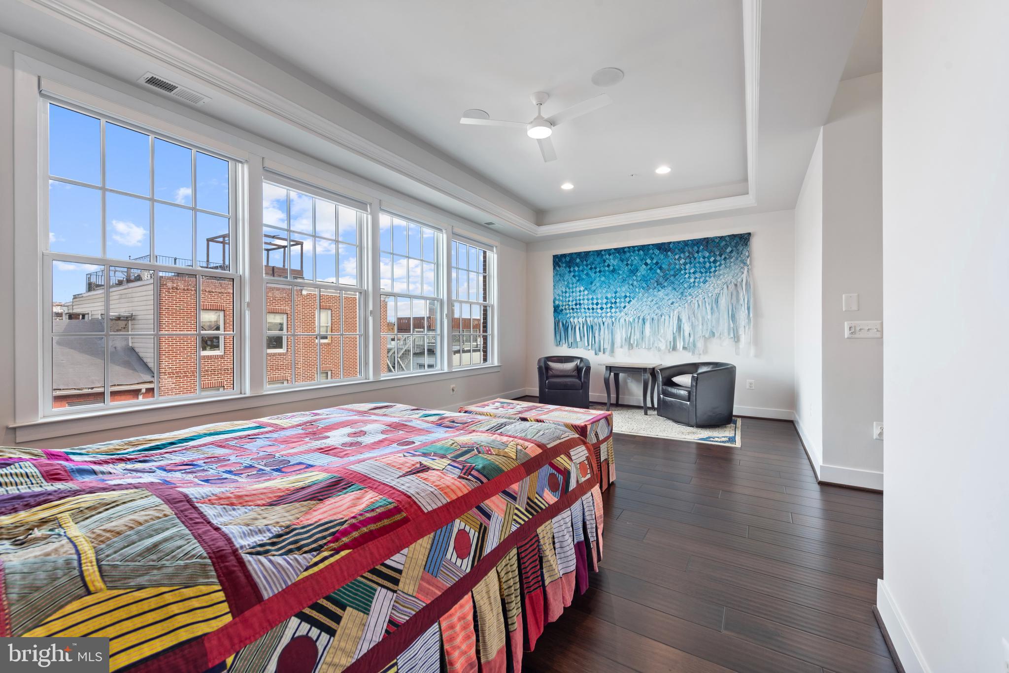 922 South Streeper Street Baltimore, MD 21224 - Photo 15 of 33 a bedroom with a bed and a large window