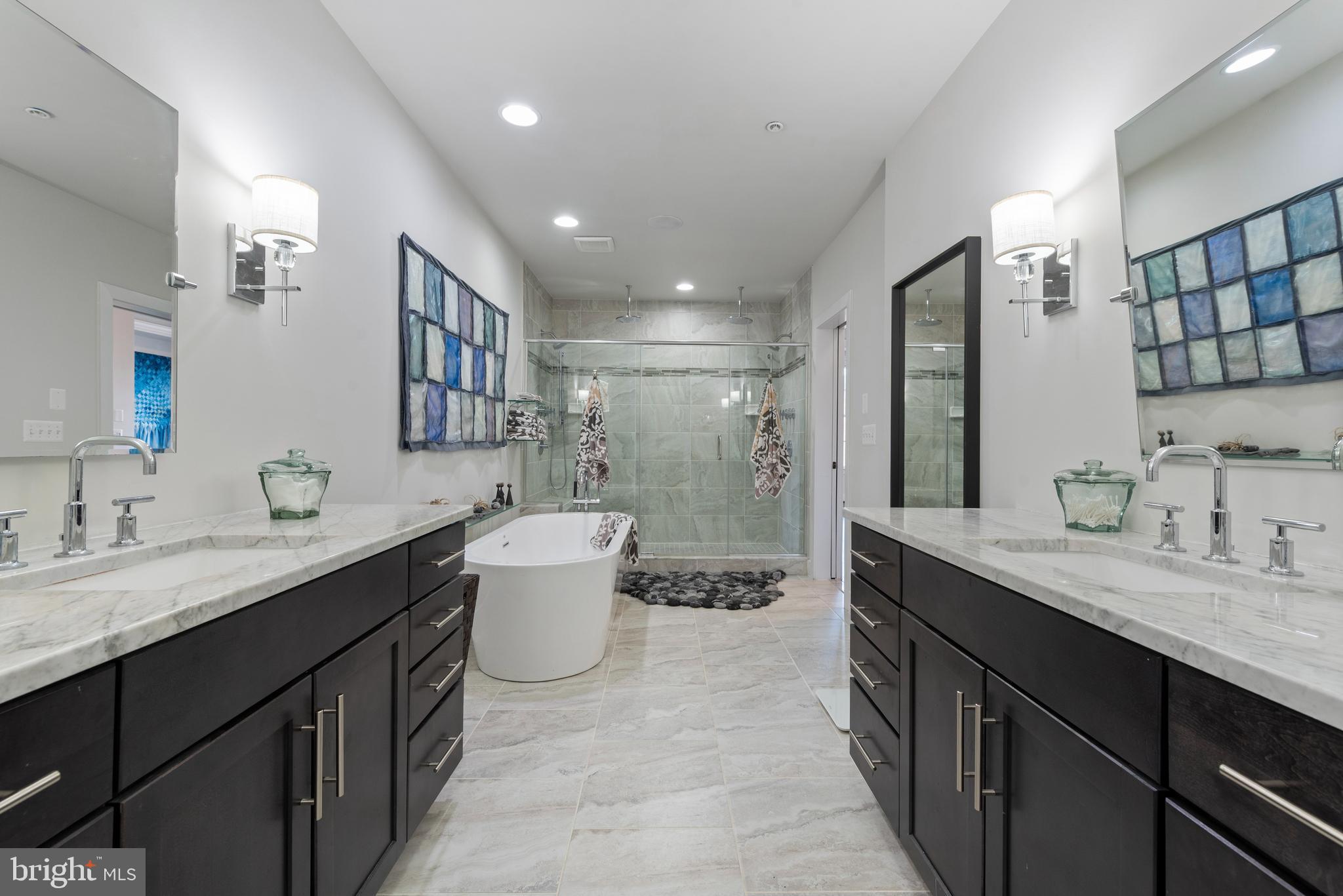 922 South Streeper Street Baltimore, MD 21224 - Photo 18 of 33 a bathroom with a double vanity sink mirror and toilet