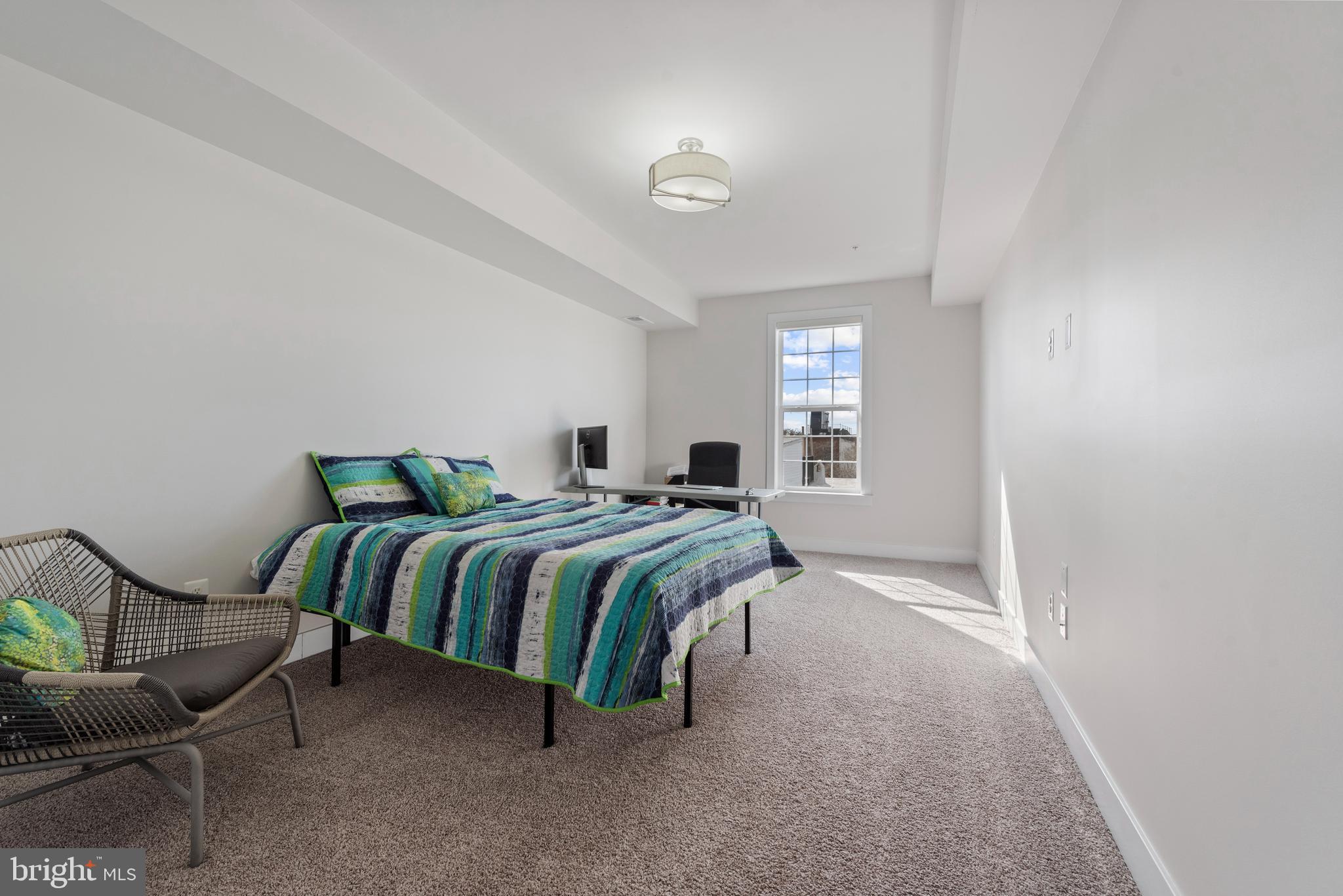 922 South Streeper Street Baltimore, MD 21224 - Photo 21 of 33 a bedroom with a bed and chair