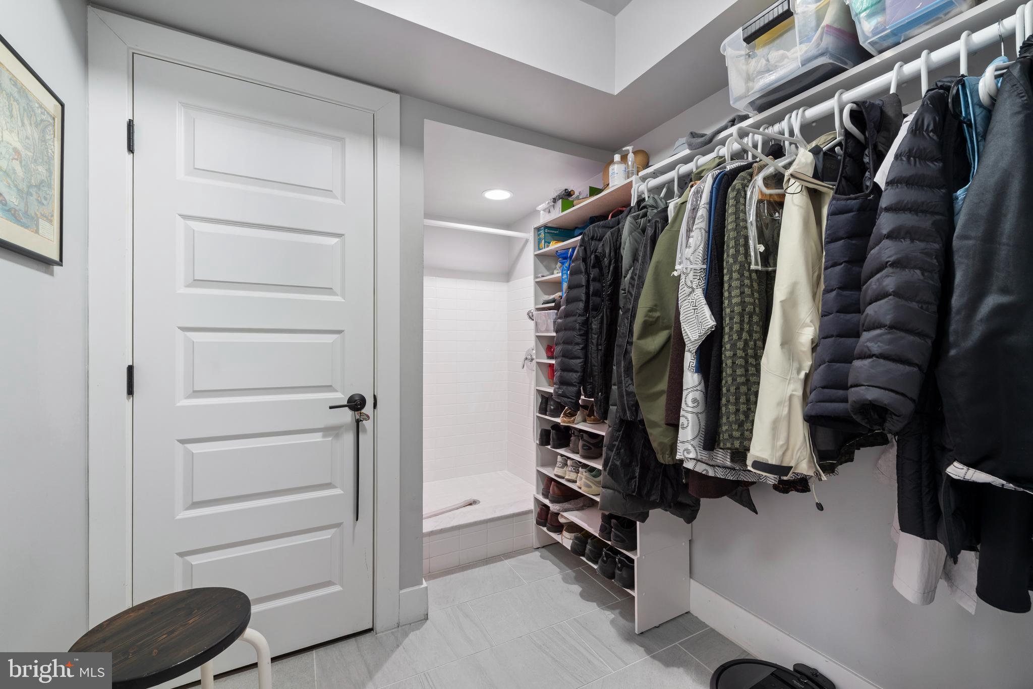 922 South Streeper Street Baltimore, MD 21224 - Photo 23 of 33 a view of walk in closet with clothes and shoes