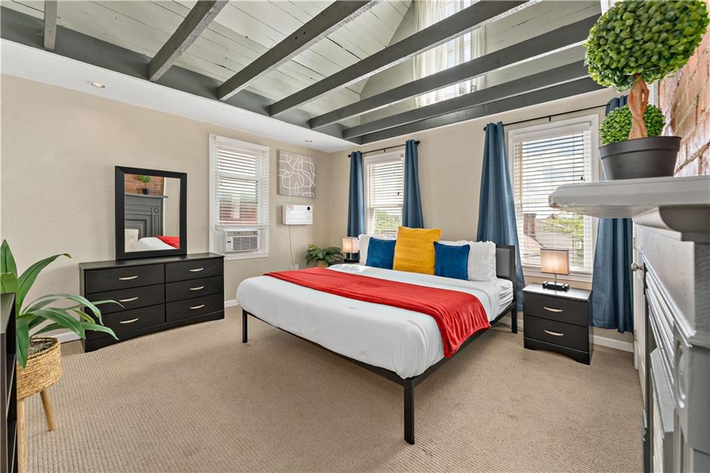 239 Albert Street Pittsburgh, PA 15211 - Photo 11 of 34 a bedroom with a bed dresser and a window