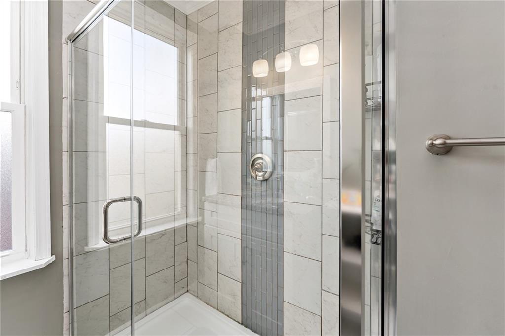 239 Albert Street Pittsburgh, PA 15211 - Photo 18 of 34 a bathroom with a shower and a sink