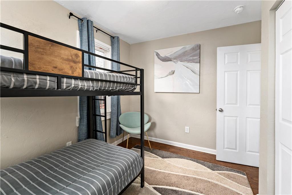 239 Albert Street Pittsburgh, PA 15211 - Photo 20 of 34 a bedroom with a bed and a painting on the wall