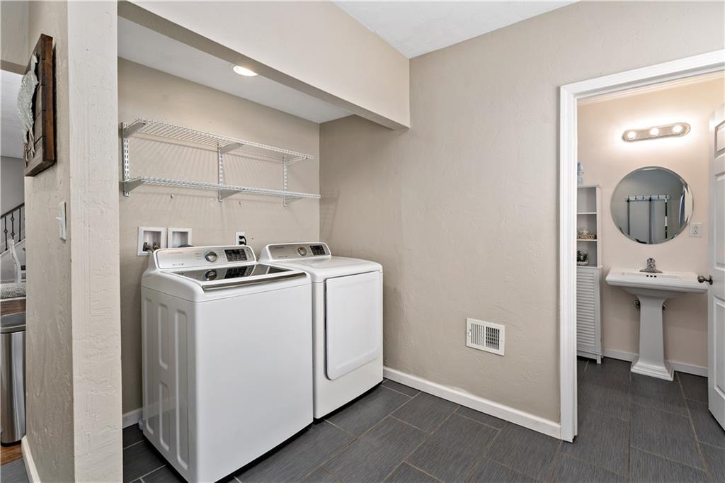 239 Albert Street Pittsburgh, PA 15211 - Photo 23 of 34 a utility room with dryer and washer