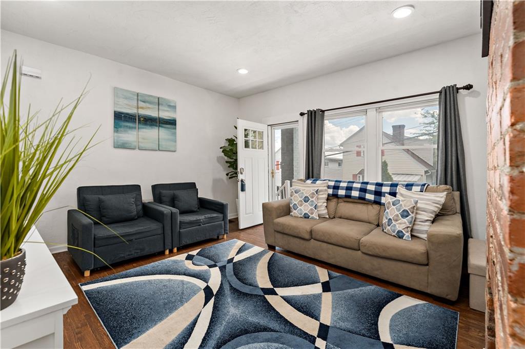 239 Albert Street Pittsburgh, PA 15211 - Photo 4 of 34 a living room with furniture and a window