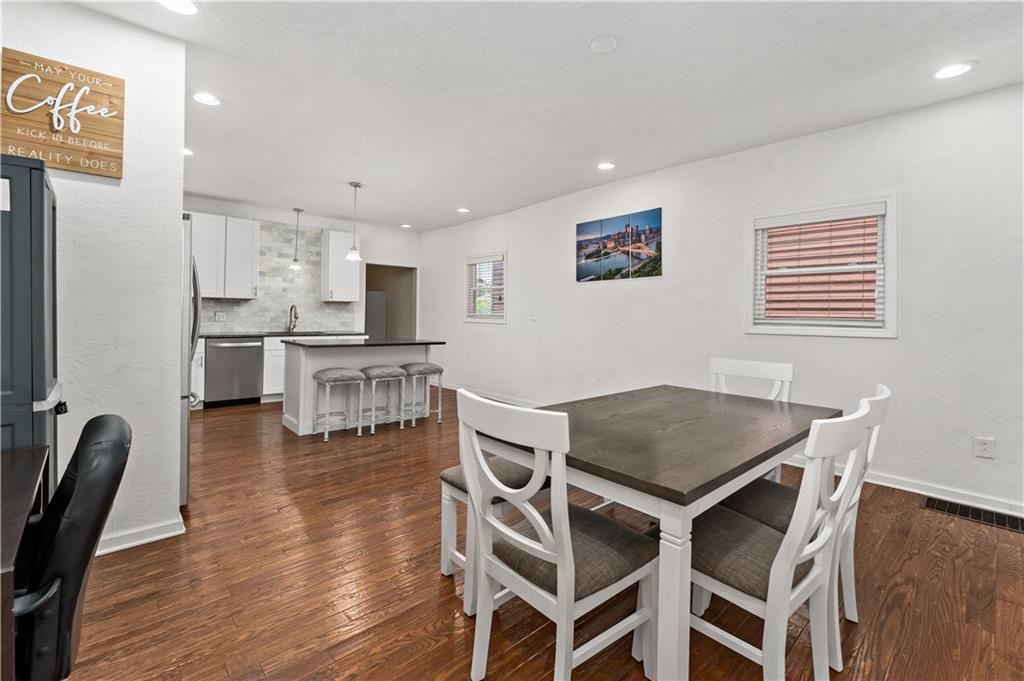 239 Albert Street Pittsburgh, PA 15211 - Photo 7 of 34 a view of a dining room with furniture and wooden floor