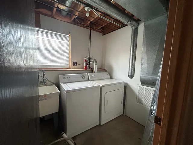 a utility room with dryer and washer
