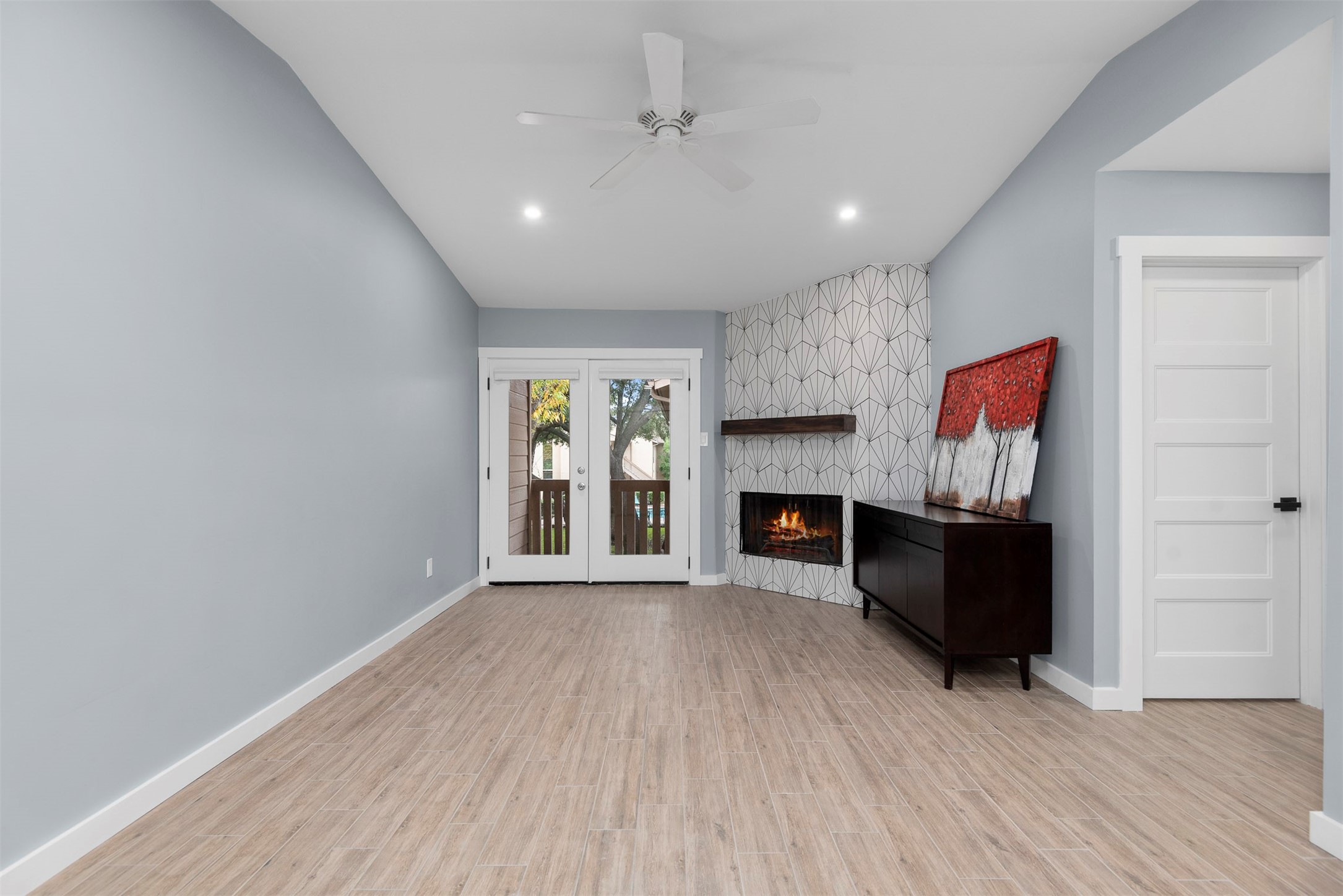 5000 Milwee Street, Unit 54 Houston, TX 77092 - Photo 4 of 25 Your retreat awaits — pool views, a redesigned fireplace, and room to breathe.