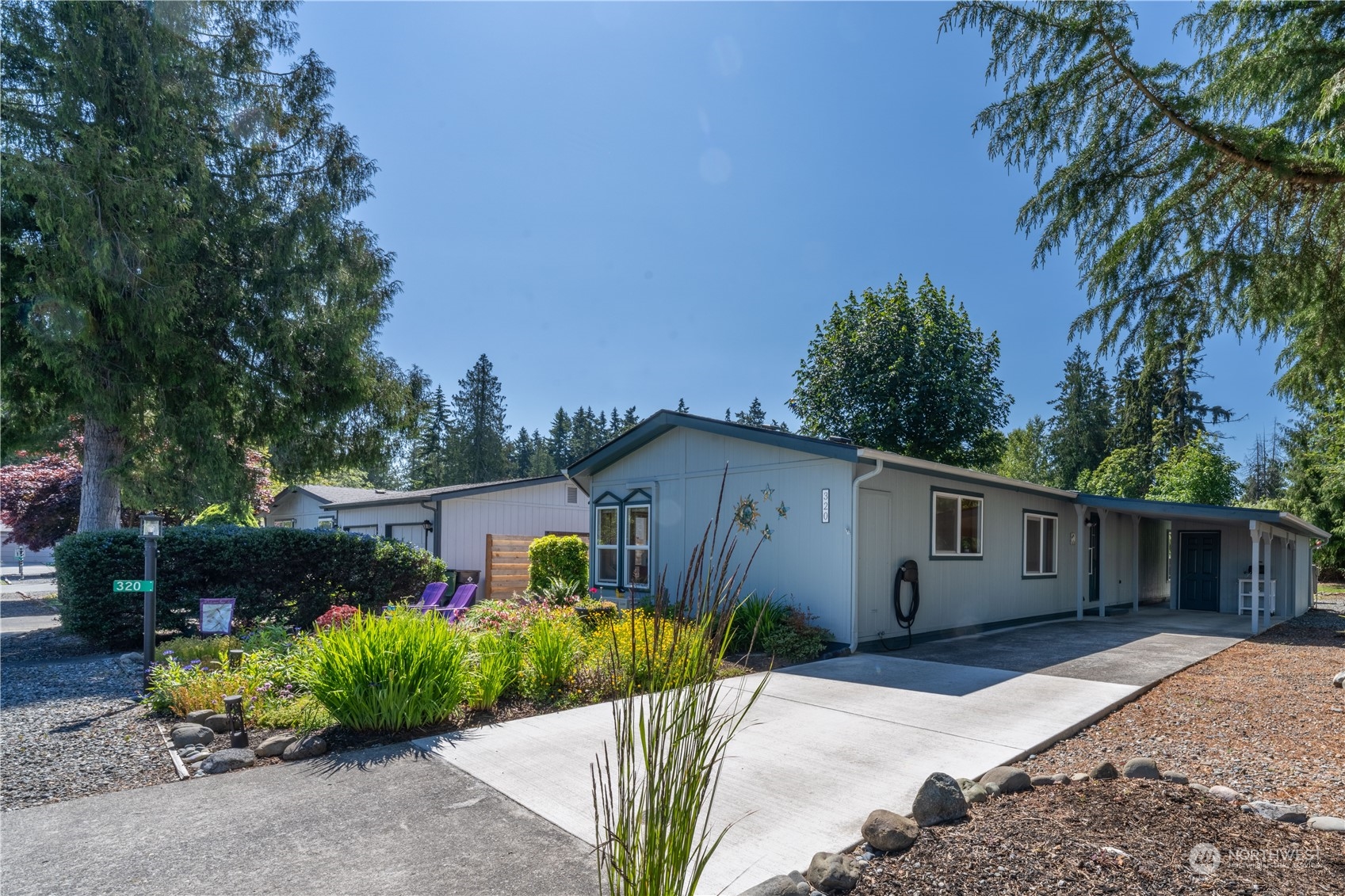 320 Fircrest Drive Sequim, WA 98382 - Photo 2 of 25 a front view of a house with garden
