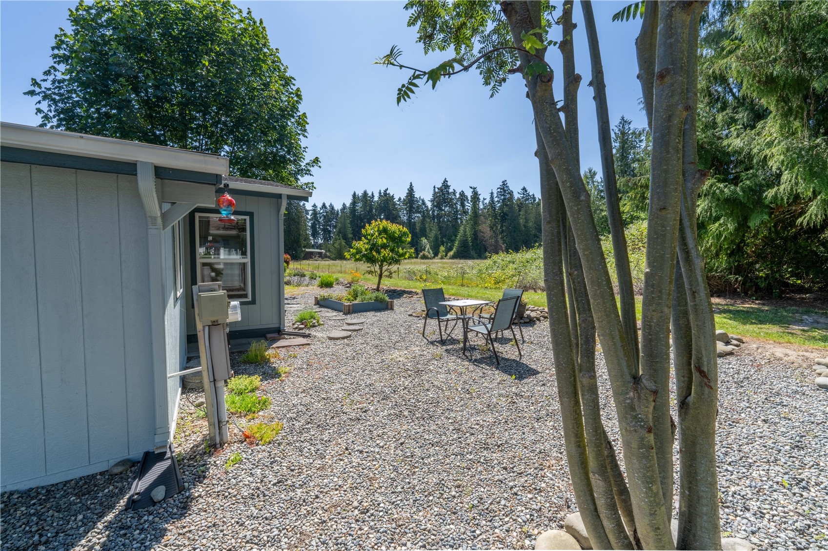 320 Fircrest Drive Sequim, WA 98382 - Photo 23 of 25 a view of a porch with furniture and garden