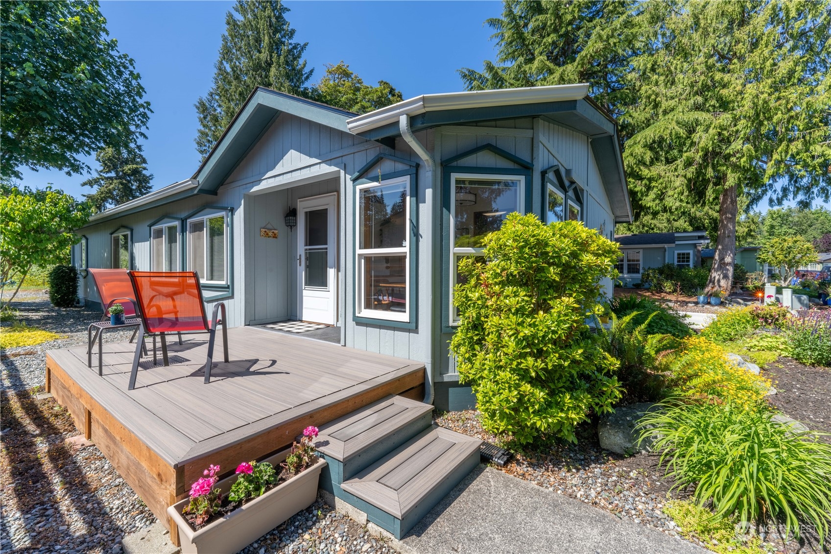 320 Fircrest Drive Sequim, WA 98382 - Photo 3 of 25 a view of a chair and table in the patio in front of house