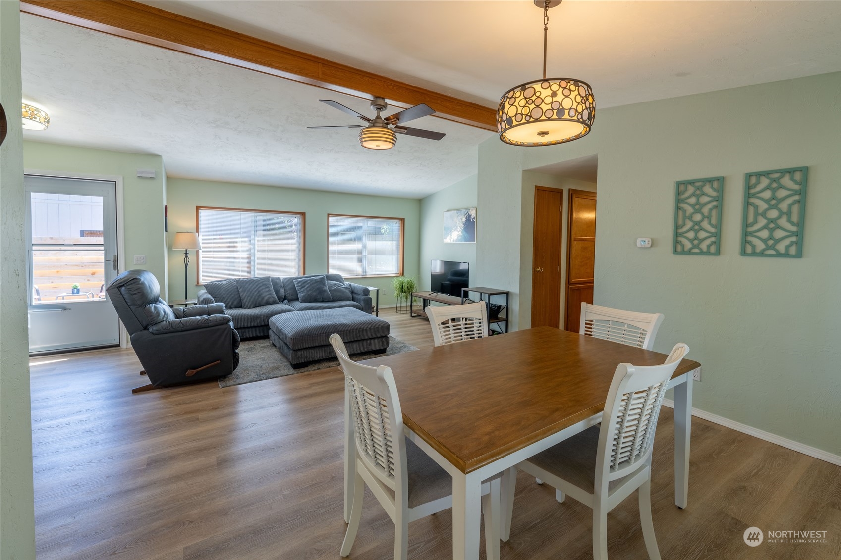320 Fircrest Drive Sequim, WA 98382 - Photo 5 of 25 a view of a dining room with furniture window and wooden floor