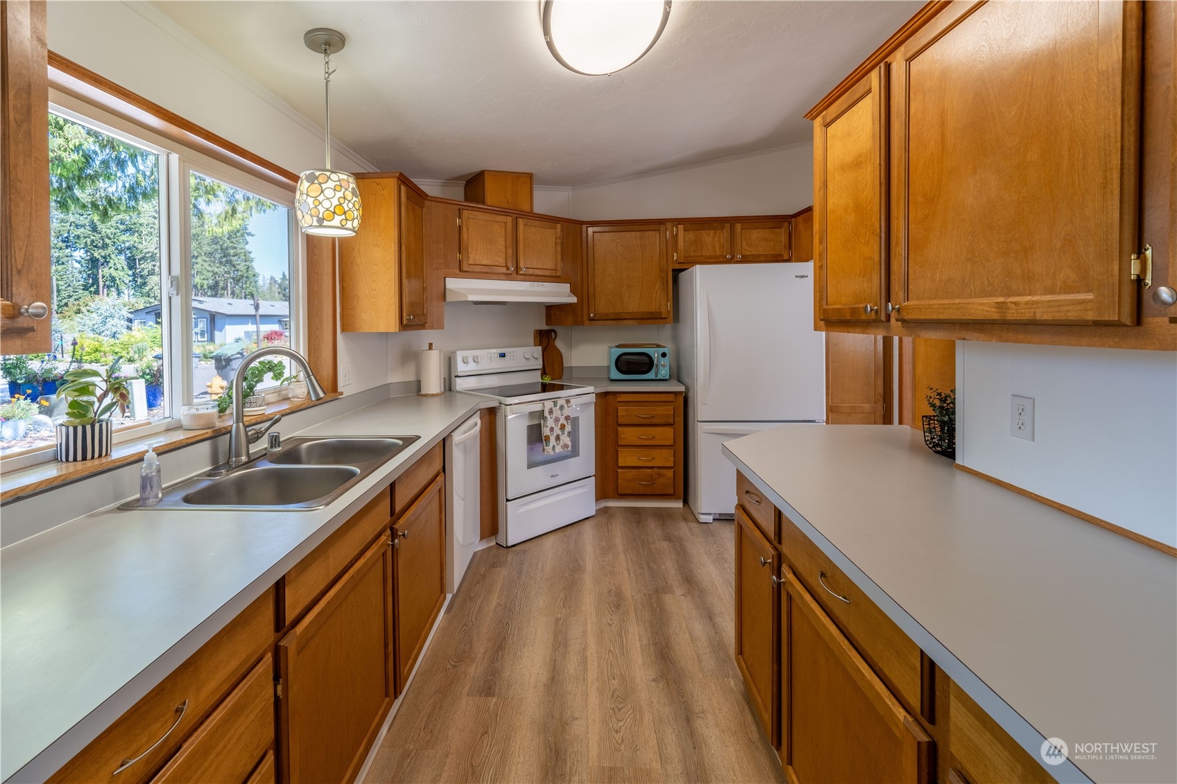 320 Fircrest Drive Sequim, WA 98382 - Photo 10 of 25 a kitchen with stainless steel appliances granite countertop sink stove and refrigerator