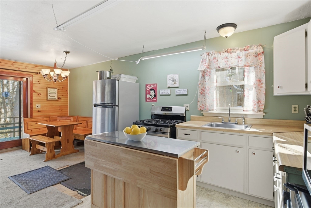 200 Fox Den Road Tolland, MA 01034 - Photo 12 of 37 a kitchen that has a lot of cabinets and stainless steel appliances