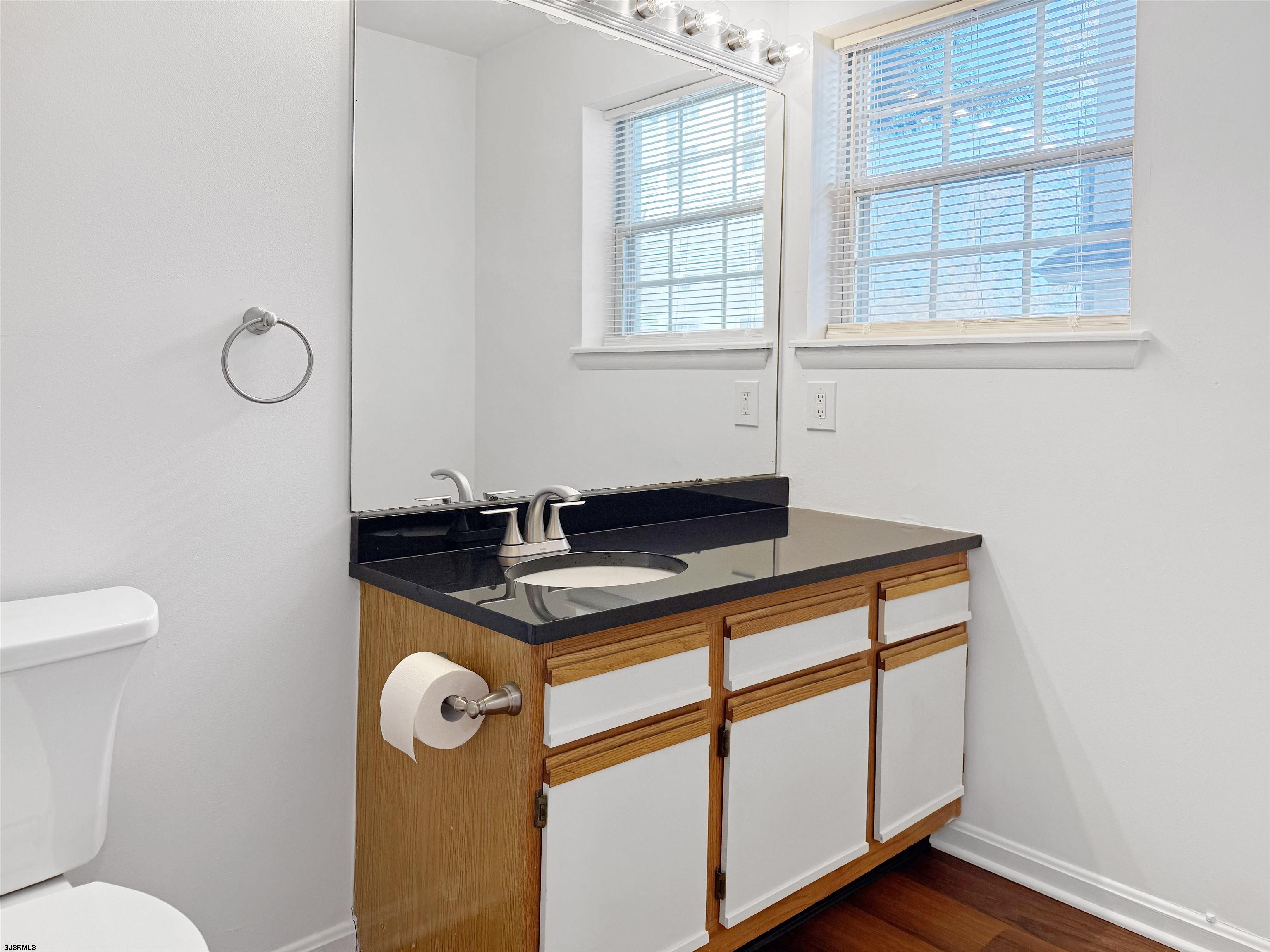 26 Malibu Way, Unit 26 Smithville, NJ 08205 - Photo 7 of 7 a bathroom with a sink toilet and window
