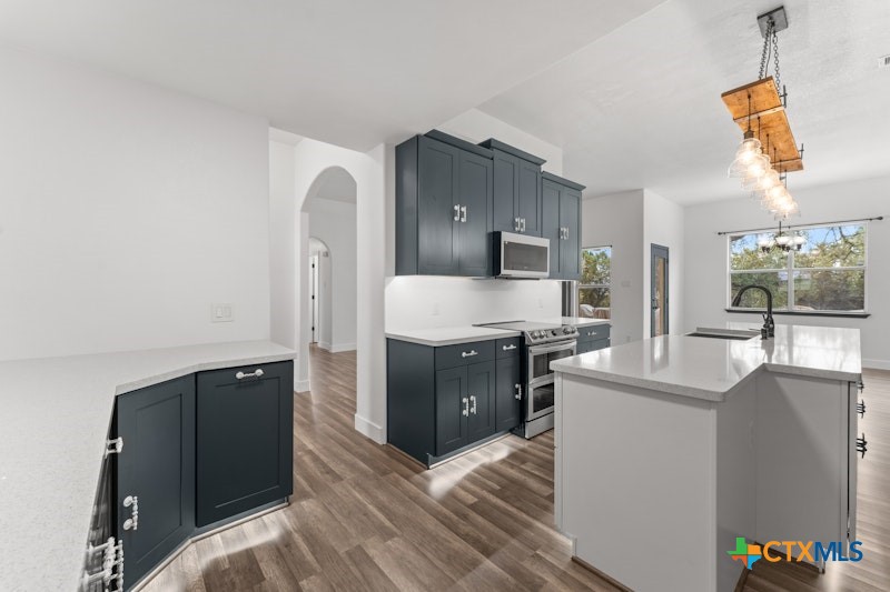 456 County Road 4711 Kempner, TX 76539 - Photo 14 of 31 a kitchen with a refrigerator and a sink
