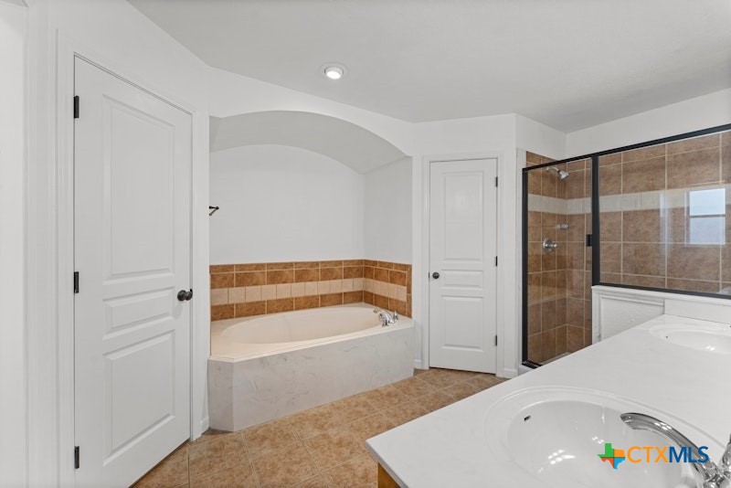 456 County Road 4711 Kempner, TX 76539 - Photo 18 of 31 a bathroom with a bathtub and a shower