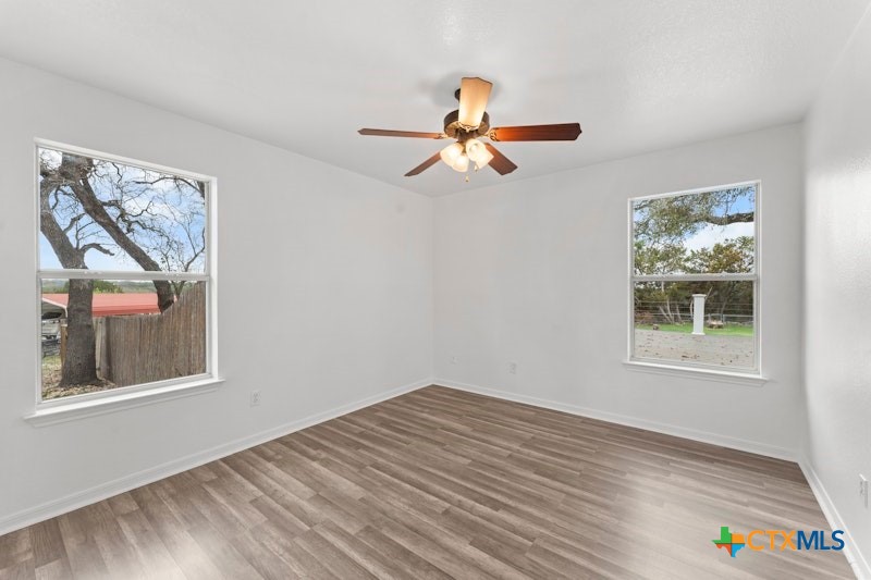 456 County Road 4711 Kempner, TX 76539 - Photo 21 of 31 a view of empty room with wooden floor and fan
