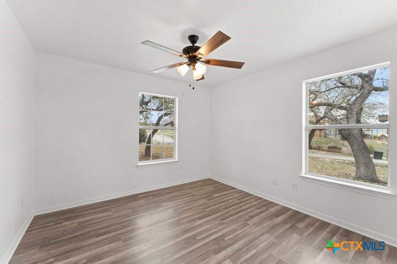 456 County Road 4711 Kempner, TX 76539 - Photo 22 of 31 a view of an empty room with a window and a fan