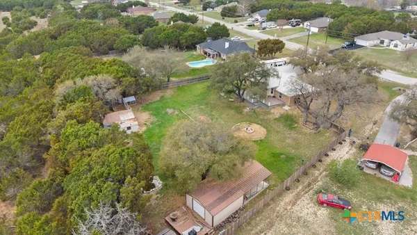 an aerial view of residential house with outdoor space