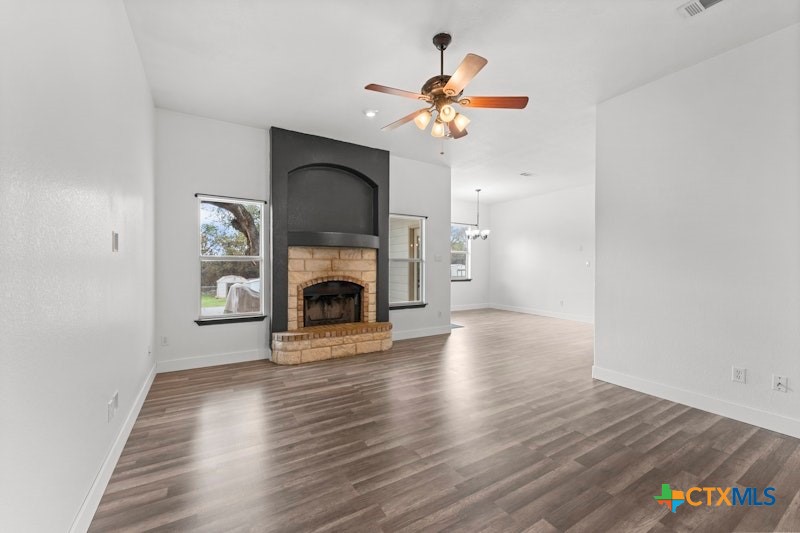 456 County Road 4711 Kempner, TX 76539 - Photo 7 of 31 a view of a livingroom with a fireplace and a chandelier