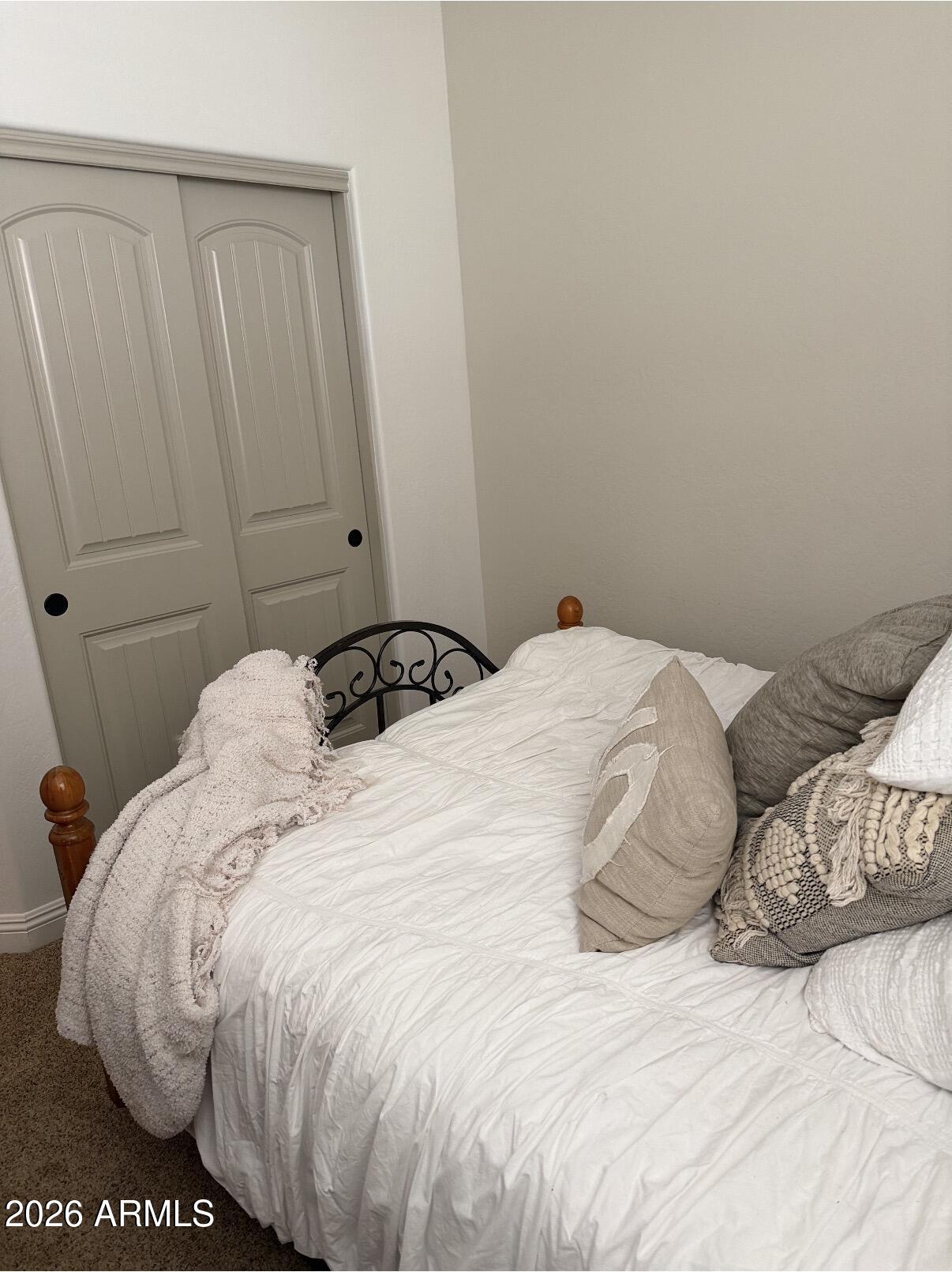 1377 South Chaparral Boulevard Gilbert, AZ 85296 - Photo 15 of 22 a large bed sitting in a bedroom next to a window
