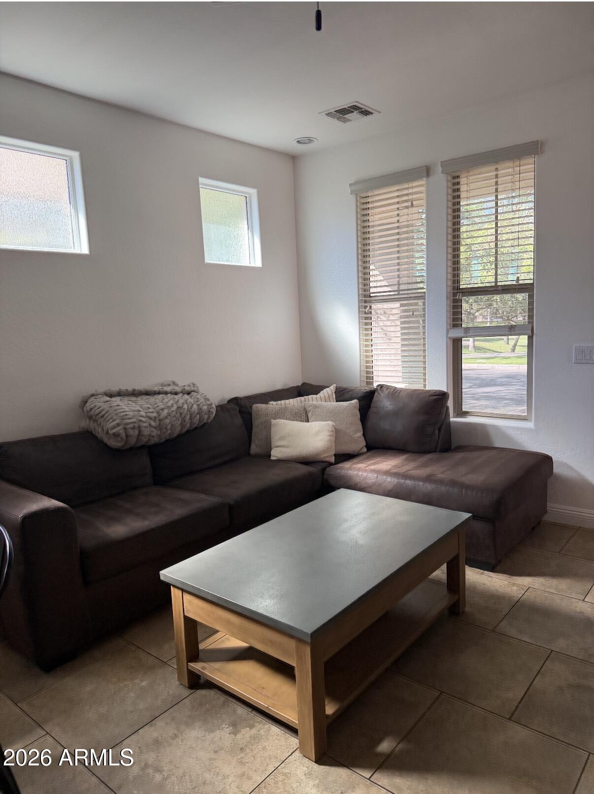 1377 South Chaparral Boulevard Gilbert, AZ 85296 - Photo 4 of 22 a living room with furniture and a window