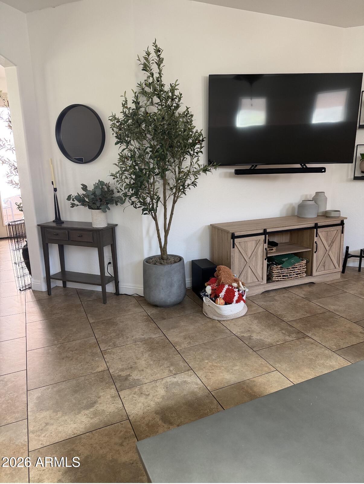 1377 South Chaparral Boulevard Gilbert, AZ 85296 - Photo 5 of 22 a living room with furniture and a flat screen tv