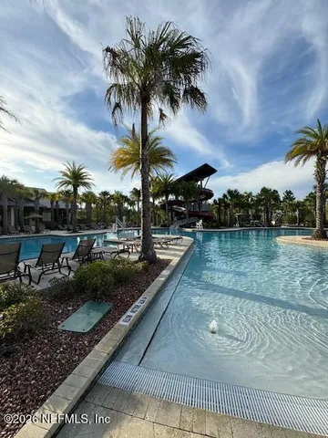 a view of outdoor space with swimming pool and patio