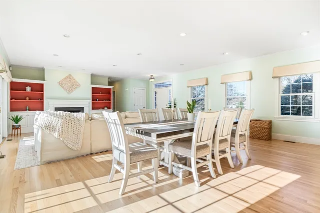 a dining room with furniture and wooden floor