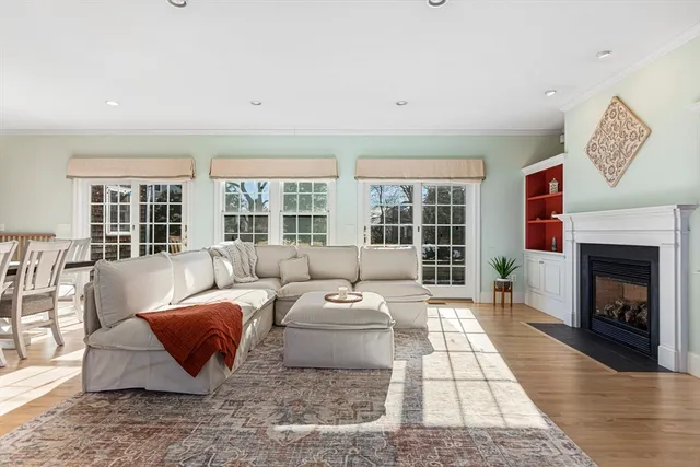 a living room with furniture rug and window