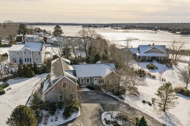an aerial view of a house with lake view