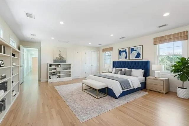 a spacious bedroom with a large bed and a couch