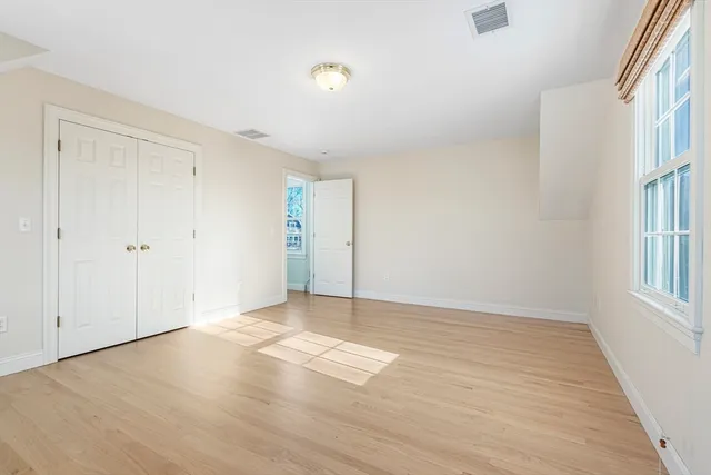 a view of workspace with wooden floor windows