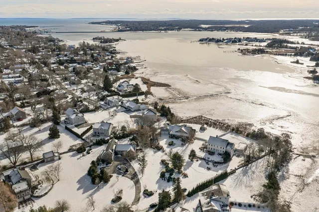an aerial view of a house with a yard