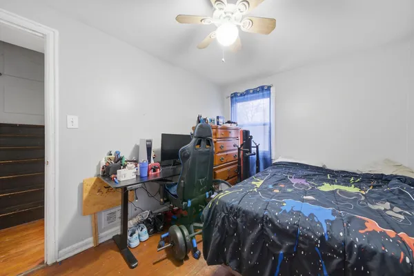 a bedroom that has a bed and a chandelier