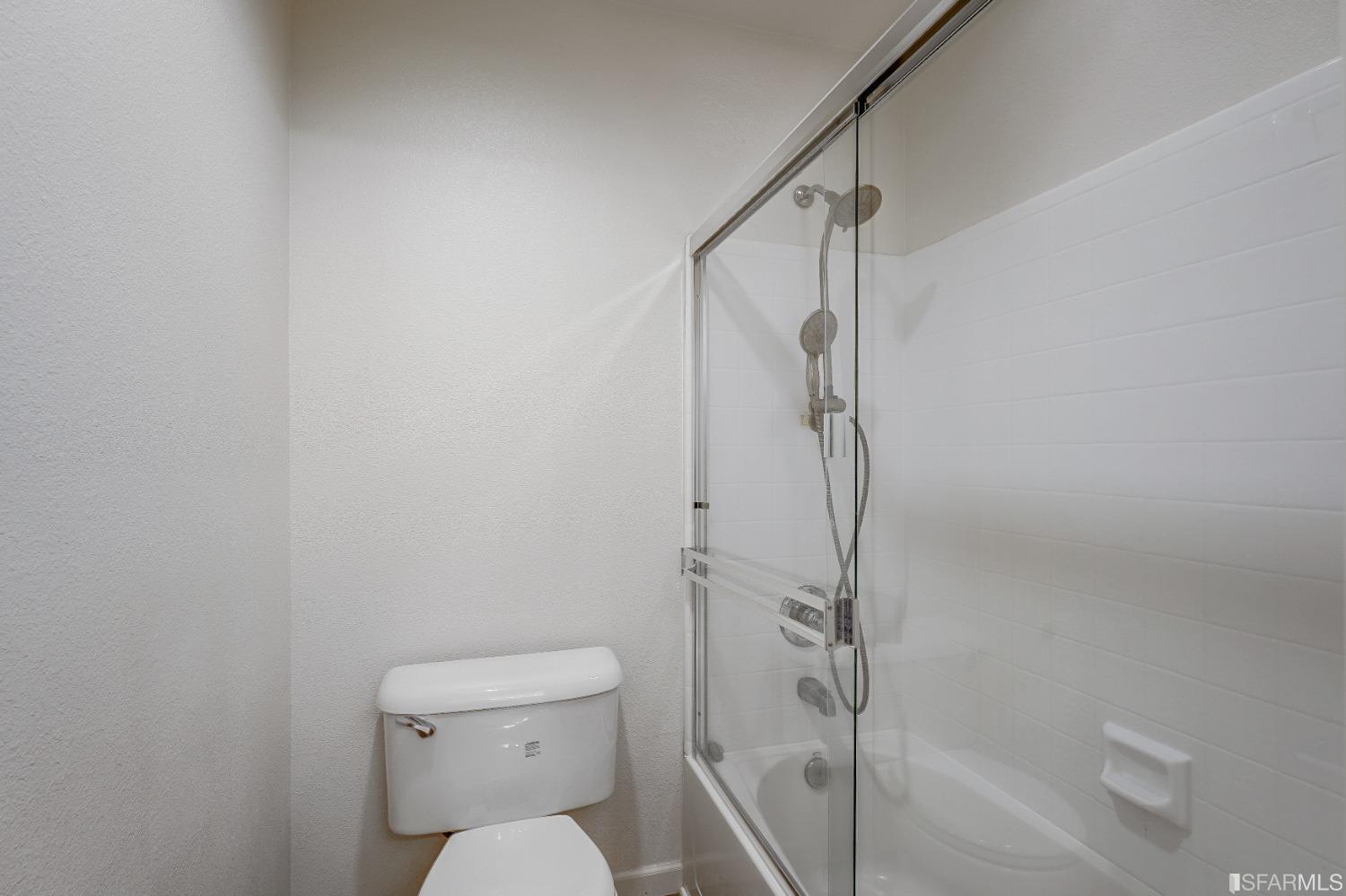 307 Hawk Ridge Drive Richmond, CA 94806 - Photo 17 of 24 a bathroom with a toilet and shower