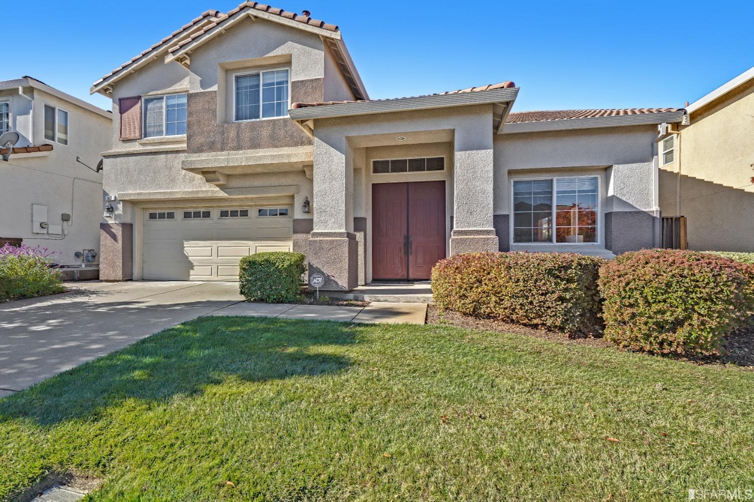 307 Hawk Ridge Drive Richmond, CA 94806 - Photo 24 of 24 a front view of a house with a garden and garage