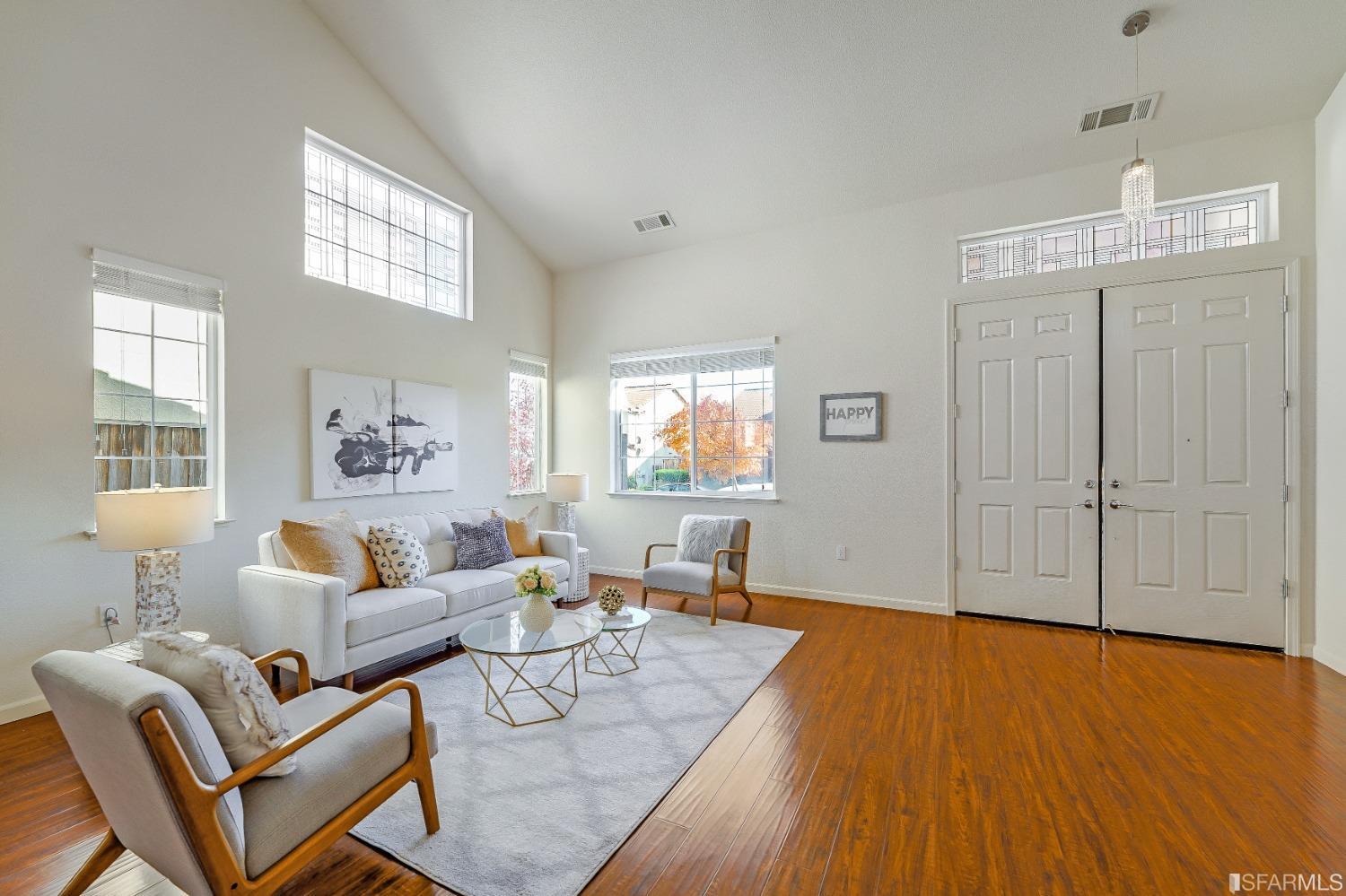 307 Hawk Ridge Drive Richmond, CA 94806 - Photo 3 of 24 a living room with furniture and a wooden floor
