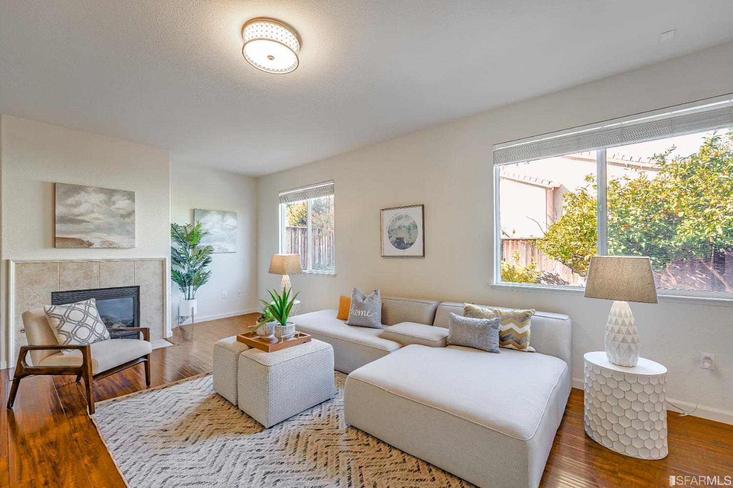 307 Hawk Ridge Drive Richmond, CA 94806 - Photo 5 of 24 a living room with furniture and a fireplace