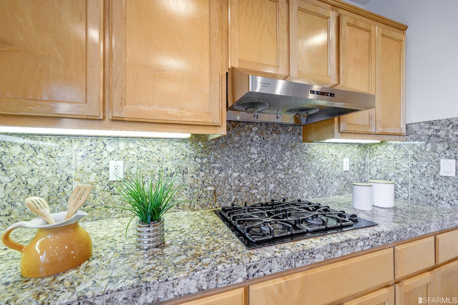 307 Hawk Ridge Drive Richmond, CA 94806 - Photo 6 of 24 a bathroom with a granite countertop sink and a mirror