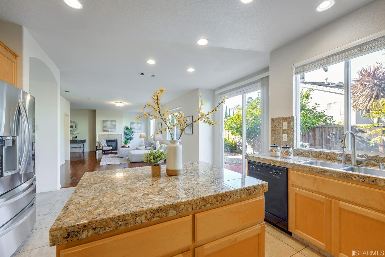 307 Hawk Ridge Drive Richmond, CA 94806 - Photo 7 of 24 a kitchen with large windows sink and living room