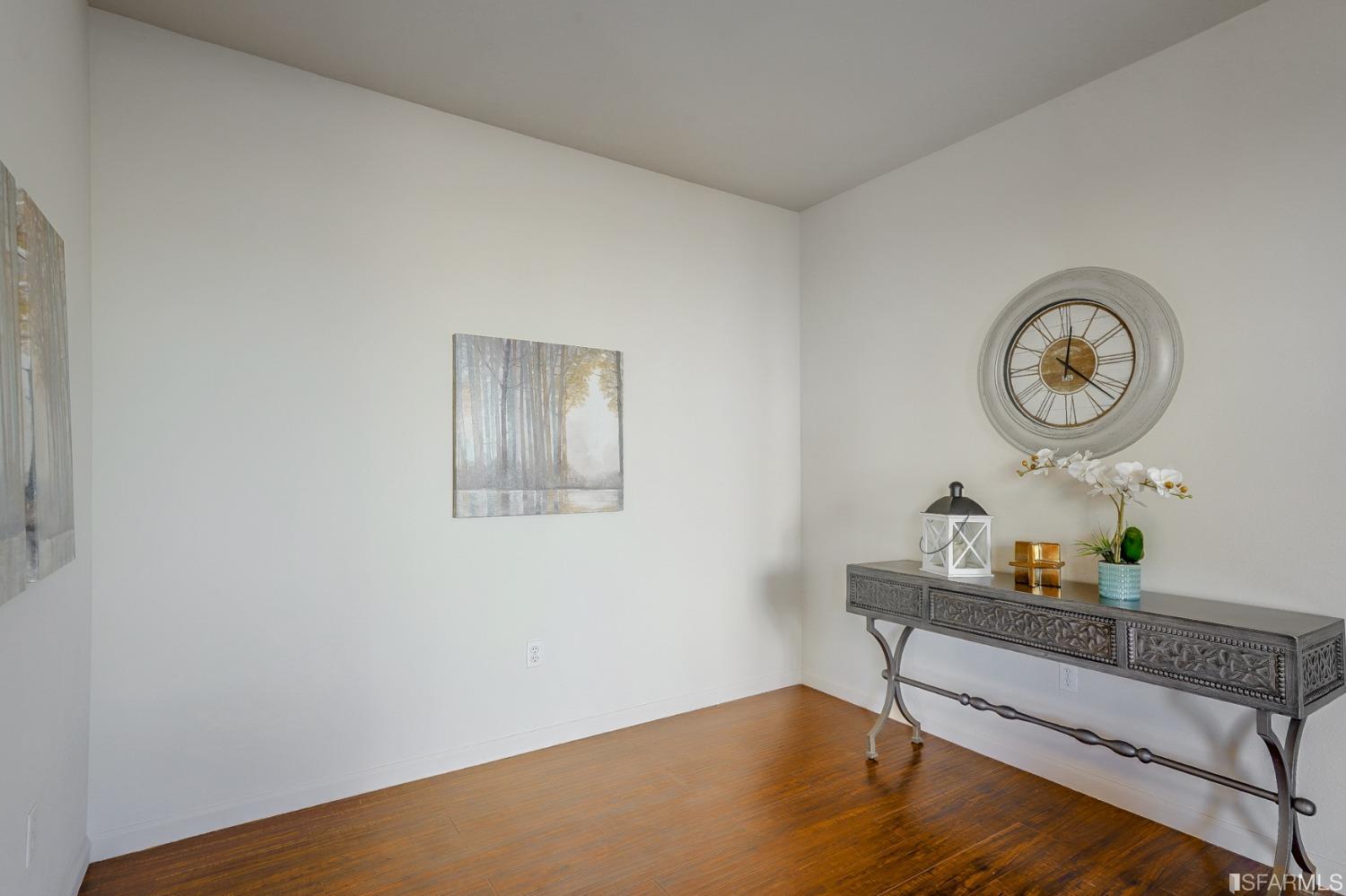 307 Hawk Ridge Drive Richmond, CA 94806 - Photo 9 of 24 a room with a wooden floor and a table in it
