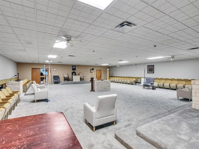 a living room with furniture and a table
