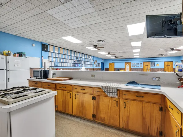 a kitchen with stainless steel appliances granite countertop a sink and a stove