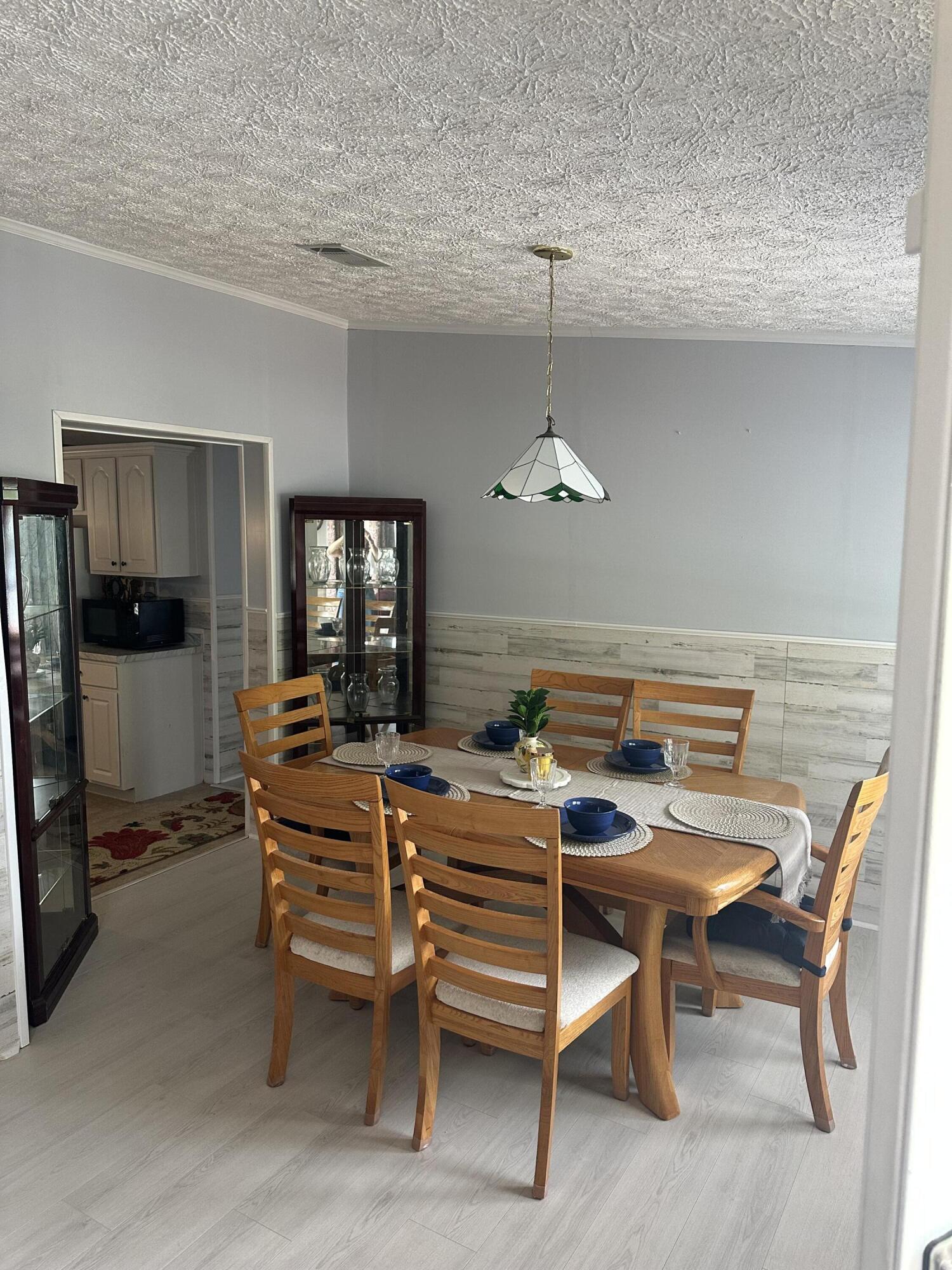 1510 Southwest 35th Circle Okeechobee, FL 34974 - Photo 24 of 53 a table and chairs in a room