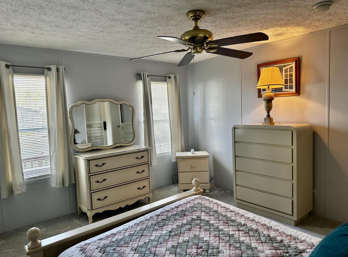 1510 Southwest 35th Circle Okeechobee, FL 34974 - Photo 8 of 53 a room with a baby crib and dresser