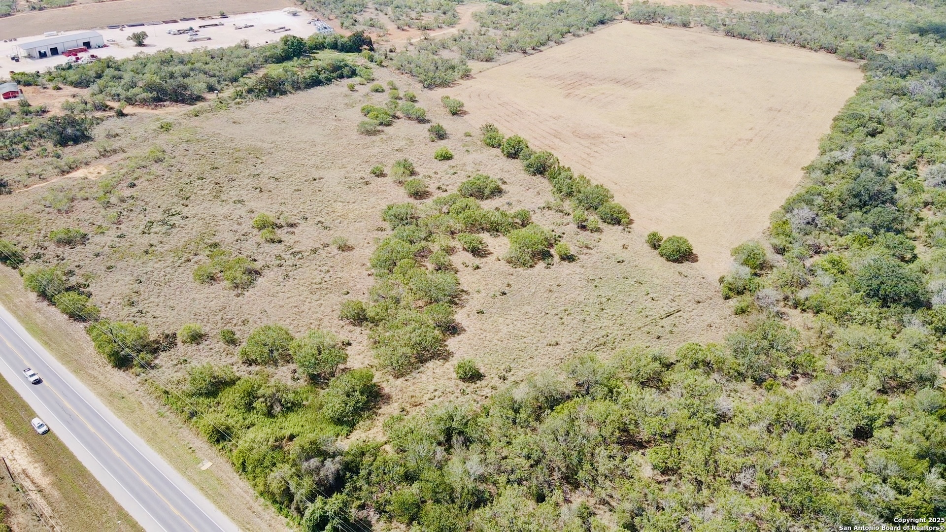 0 North State Highway 16 Jourdanton, TX 78026 - Photo 20 of 21 a view of a wooden floor with a yard