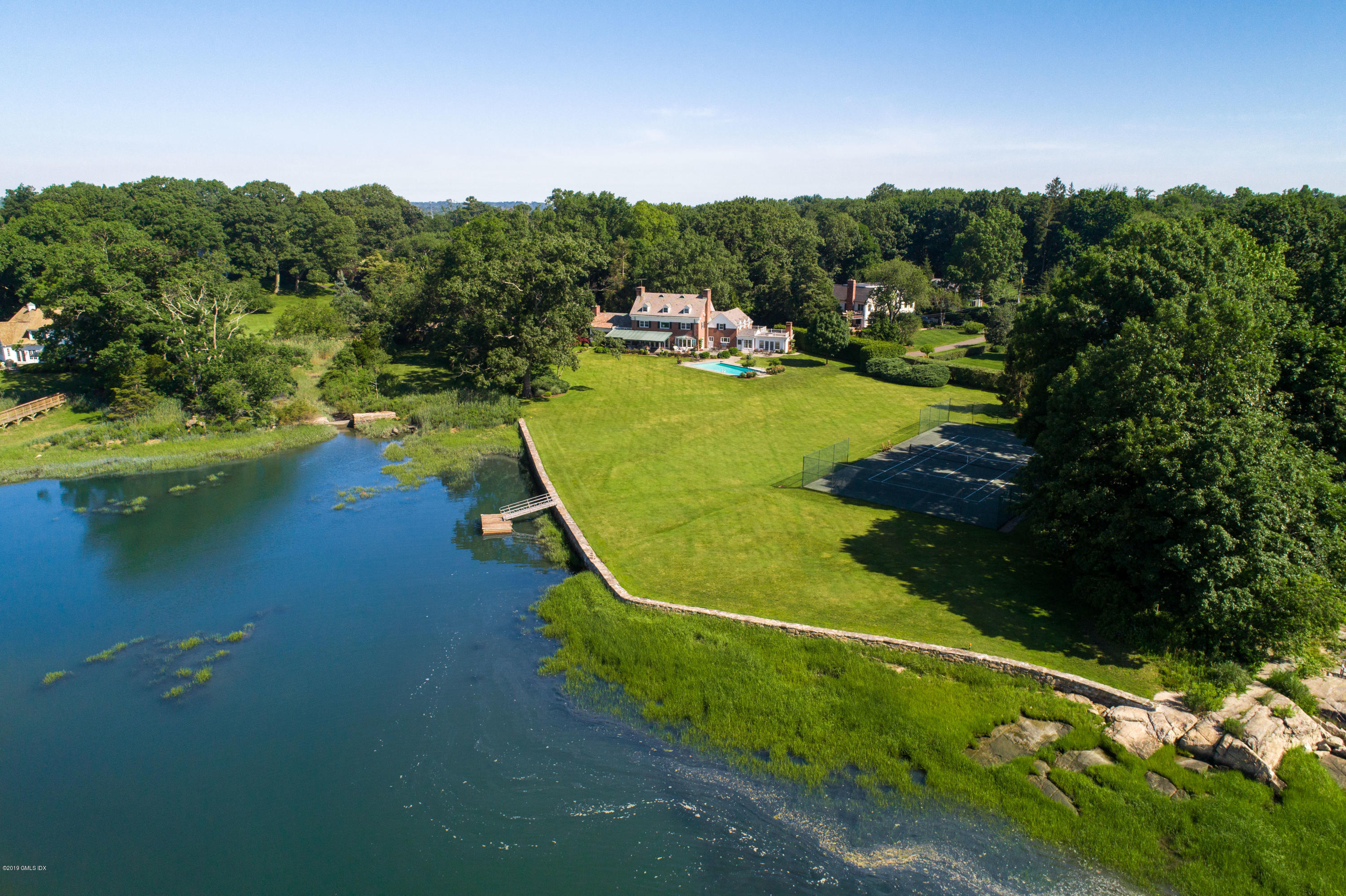 a view of a lake with a yard