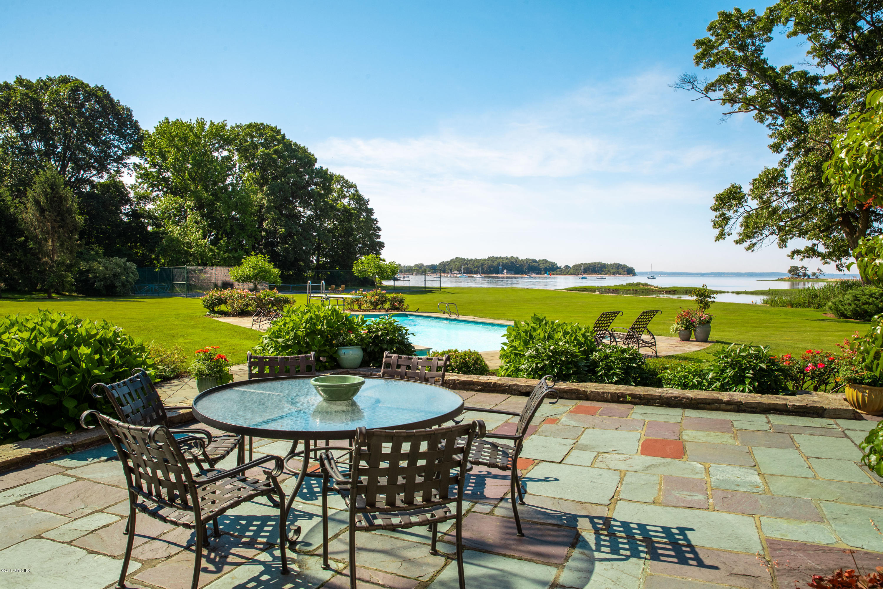 78-80 Cedar Cliff Road Riverside, CT 06878 - Photo 14 of 24 a view of swimming pool with outdoor seating and plants
